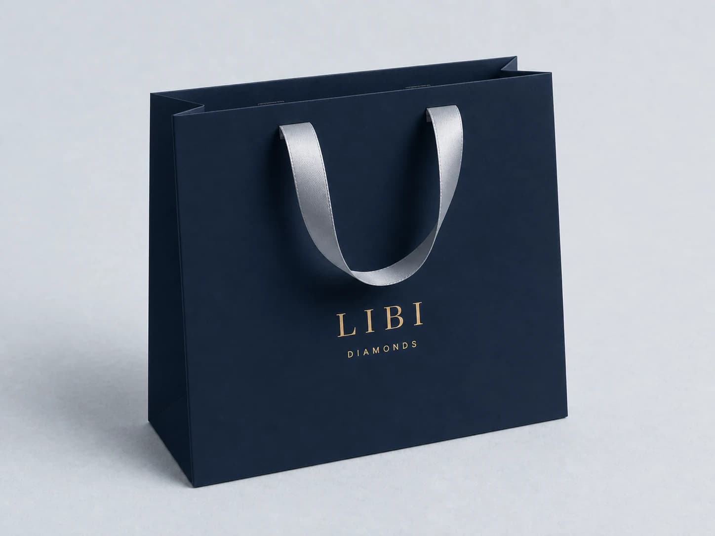שקית קנייה של LIBI DIAMONDS בכחול חצות עם ידיות סרט כסופות